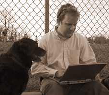 Trainer with computer and Dog